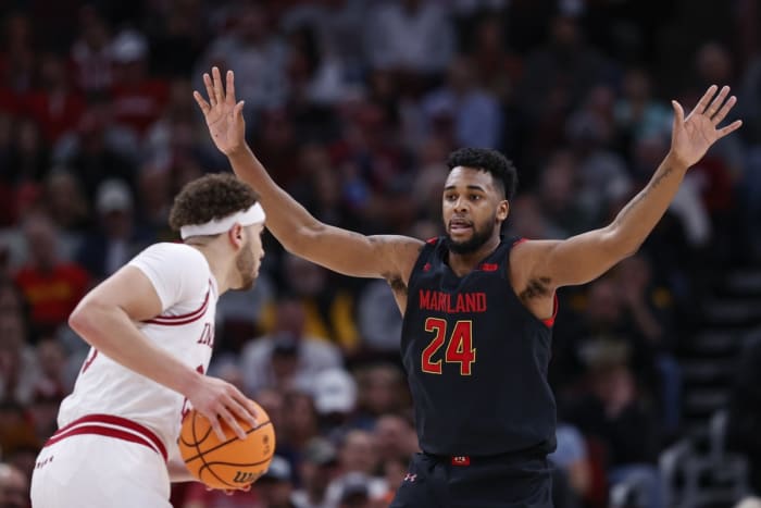 Indiana Hoosiers forward Race Thompson (left) at United Center looks to pass as Maryland's Donta Scott (24) defends.